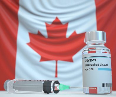 Covid-19,Coronavirus,Disease,Vaccine,Vial,And,Syringe,Against,The,Canadian