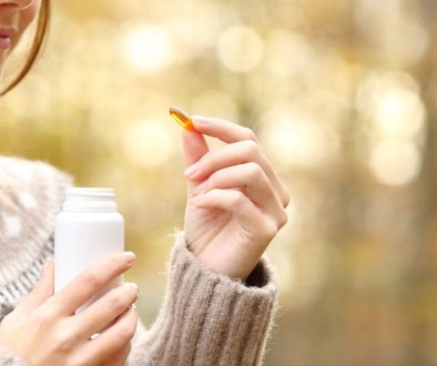 Close,Up,Of,Woman,Hand,Holding,A,Vitamin,Pill,And